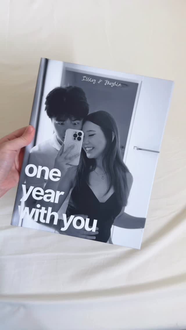 Photo album cover with a black and white couple selfie and anniversary text.