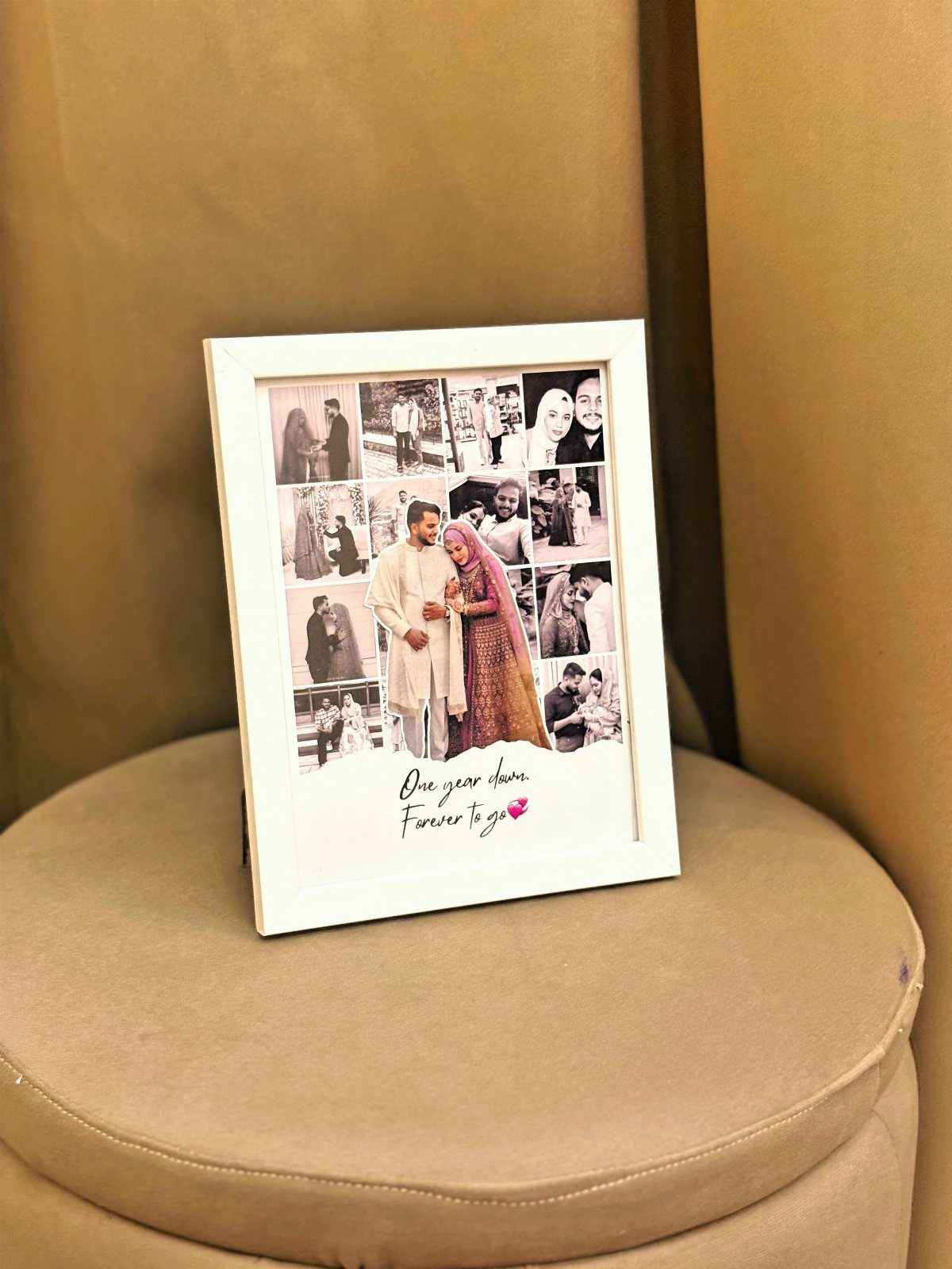 White picture frame with a photo collage of a couple on a tan ottoman