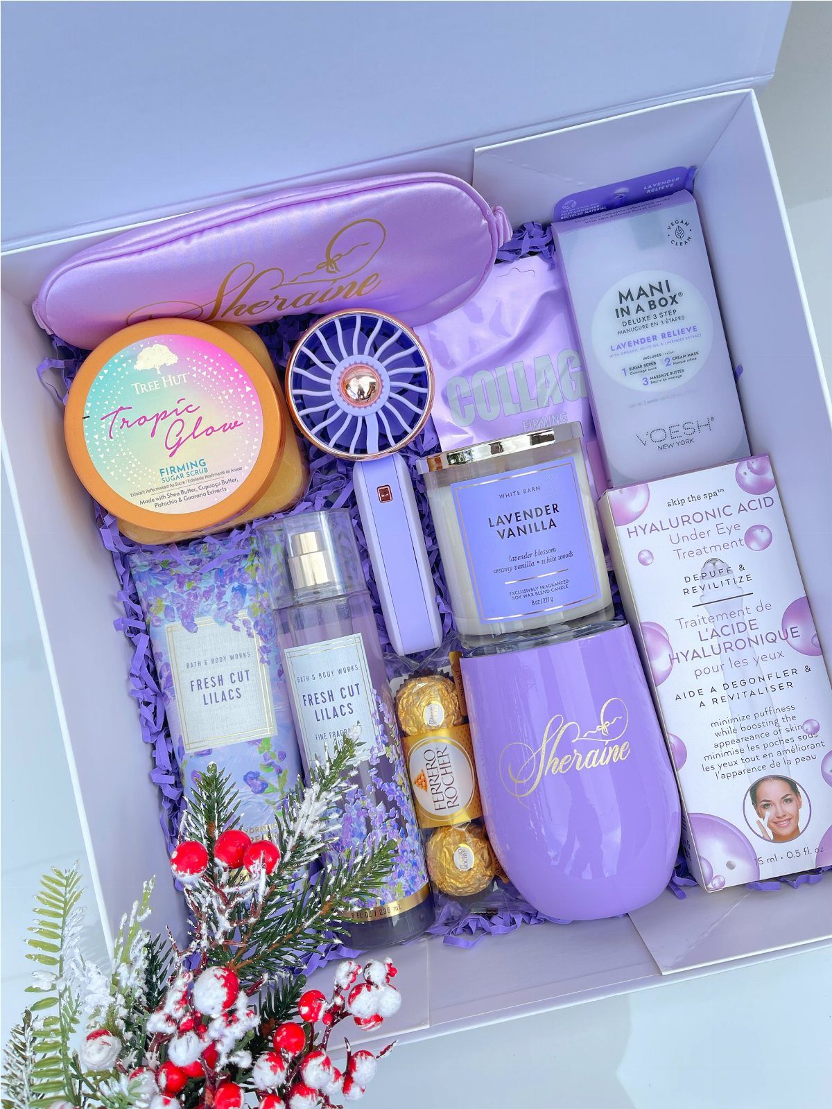 Luxury spa bath products set in a white box with purple themed toiletries.