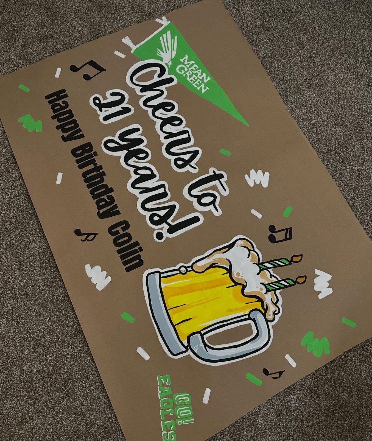 Hand-painted birthday banner with a beer mug illustration and 21st birthday text.