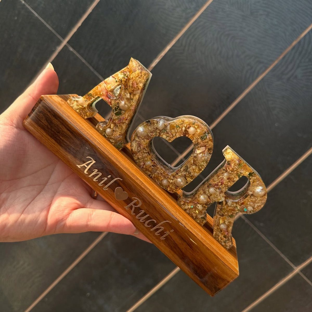 Personalized resin art with initials A and R and names Anil and Ruchi