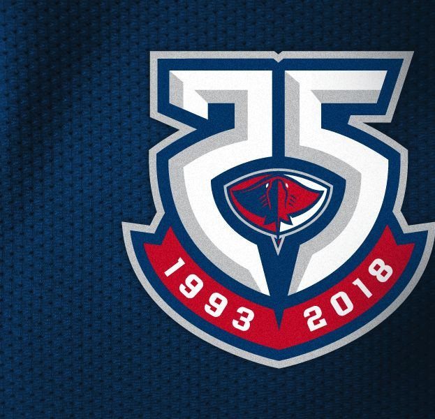 White number 25 anniversary logo with red ribbon and blue background