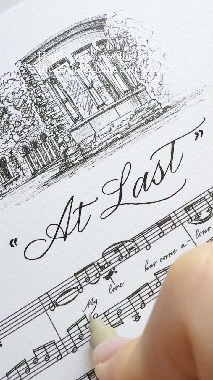 Hand drawing custom song lyric art with a building sketch and musical notes.