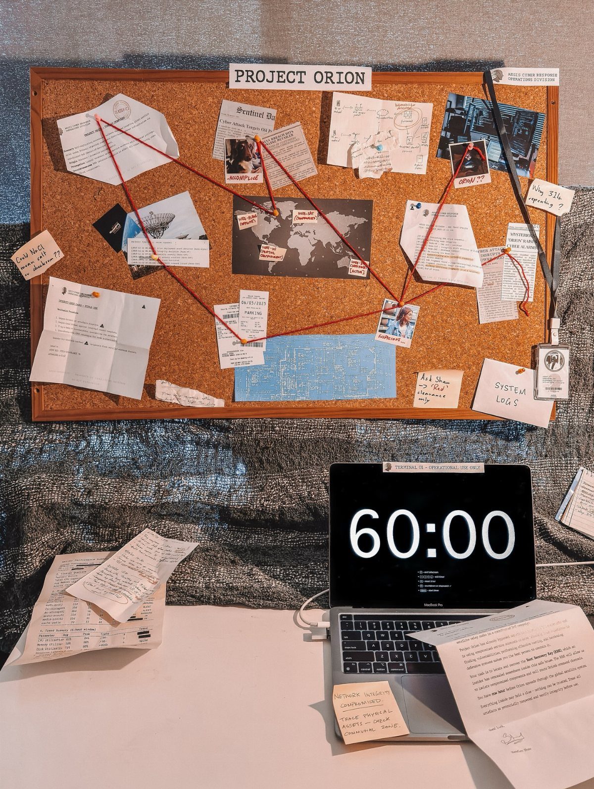 Corkboard with red string connections and a laptop showing a 60 minute countdown timer.