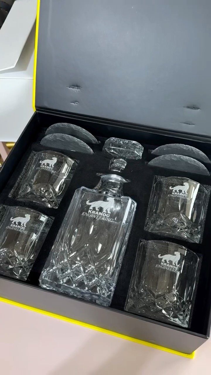 Crystal decanter and glasses set with custom logo in a black gift box.