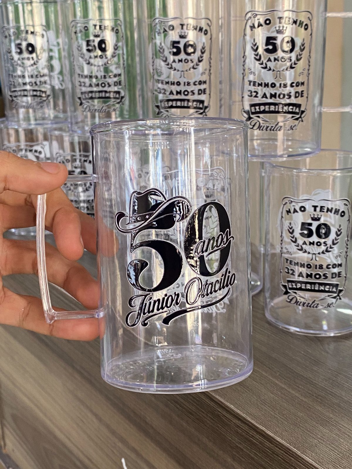 Clear plastic beer mug with black 50th birthday cowboy theme personalization and name.