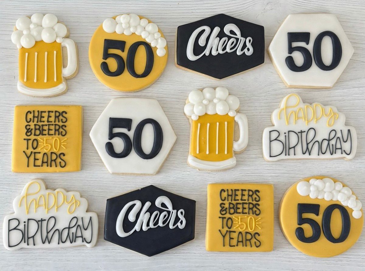 Decorated birthday cookies featuring beer mugs, the number 50, and celebratory messages.