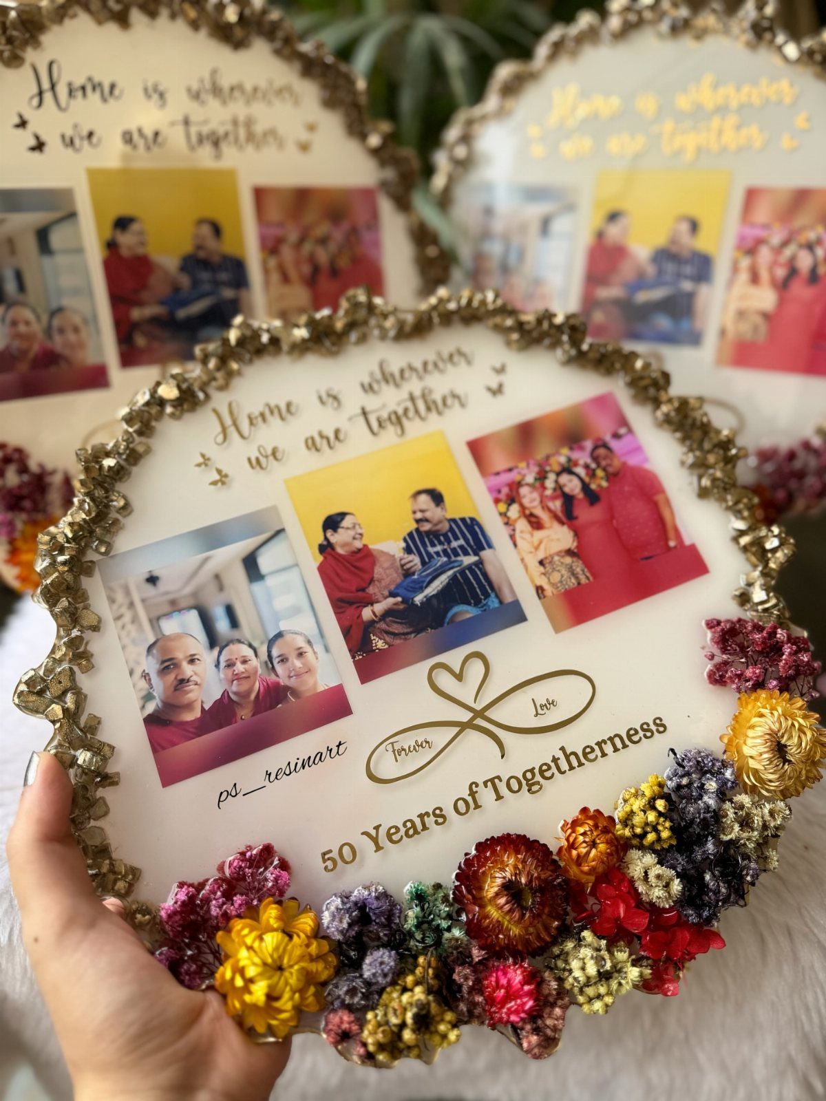 Circular resin plaque with family photos, gold border, and 50th anniversary text.