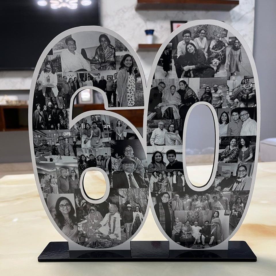 Number 60 photo collage sculpture featuring black and white family portraits on a base