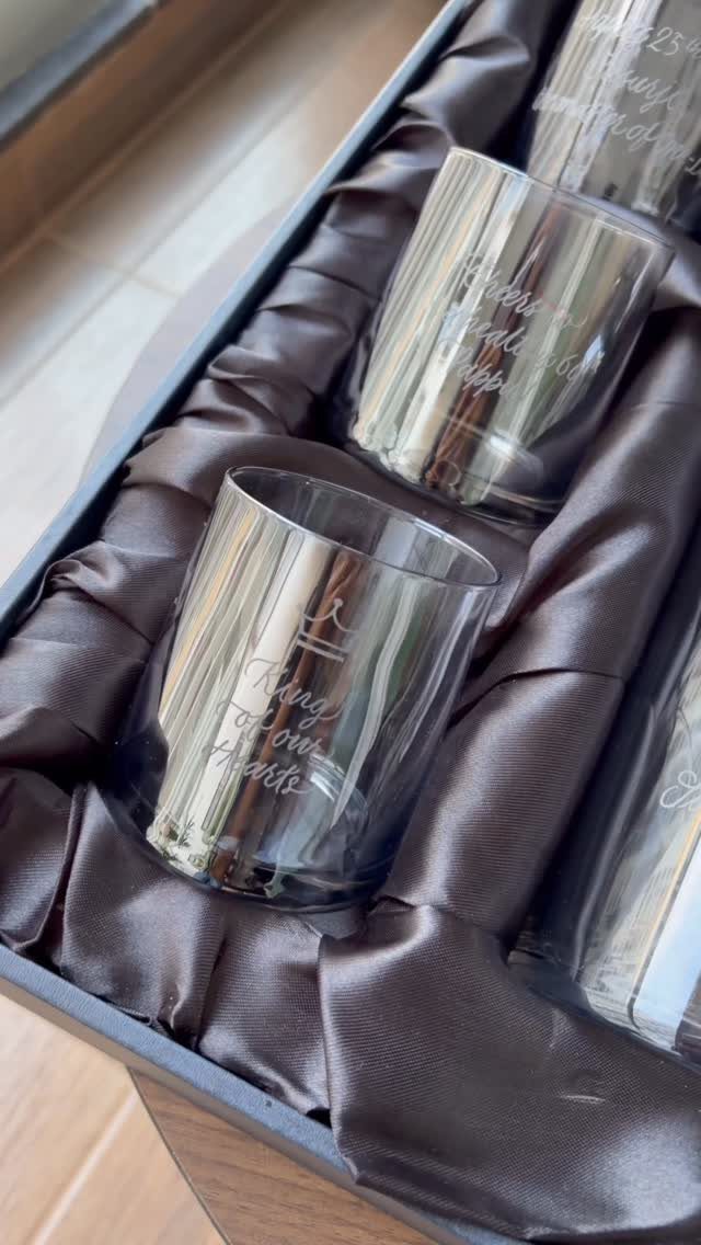 Engraved glass tumblers in a satin-lined gift box with crown and text designs