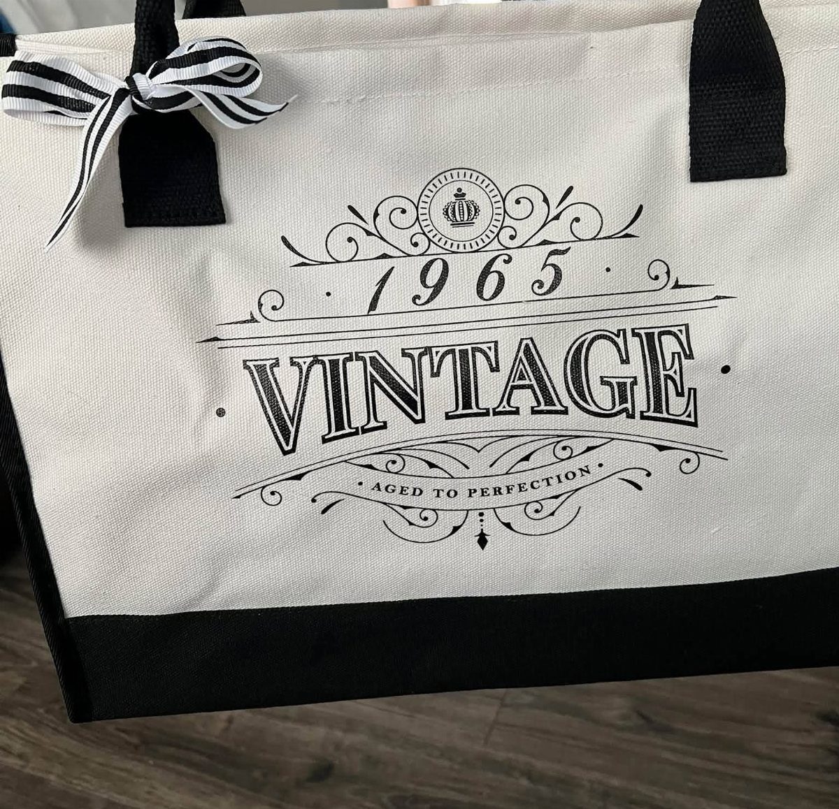 White canvas tote bag with 1965 Vintage Aged to Perfection printed design