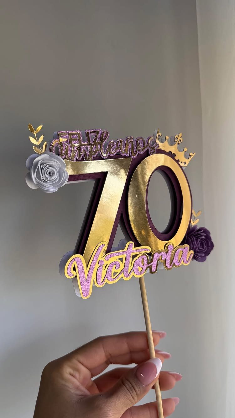 Custom gold and purple 70th birthday cake topper with the name Victoria.