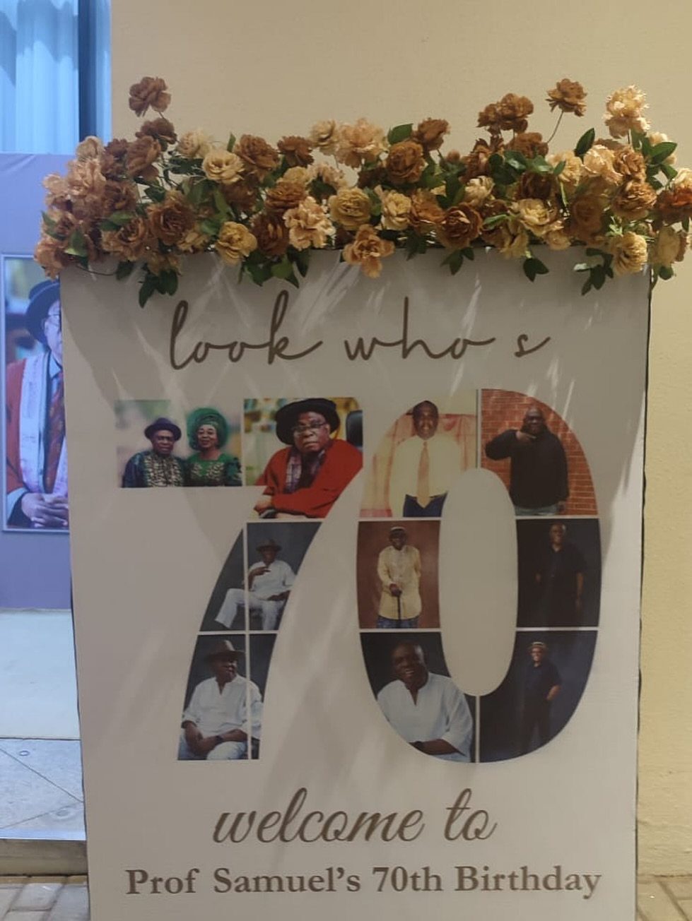 Welcome sign for 70th birthday with photos inside a large number 70