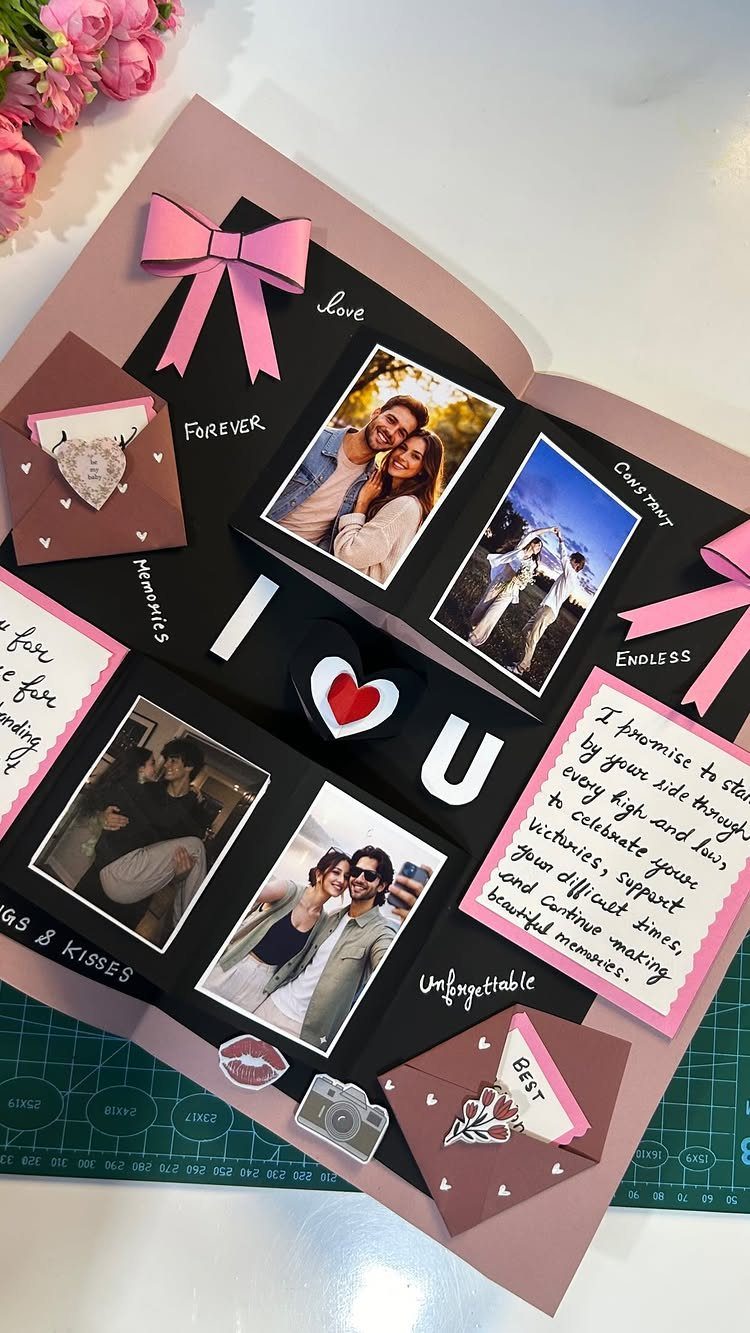 Handmade pop-up scrapbook page with couple photos, pink bows, and romantic notes.