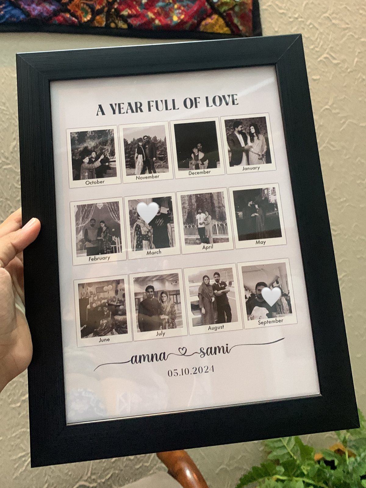 Black photo frame containing a grid of twelve monthly couple photos and personalized text.