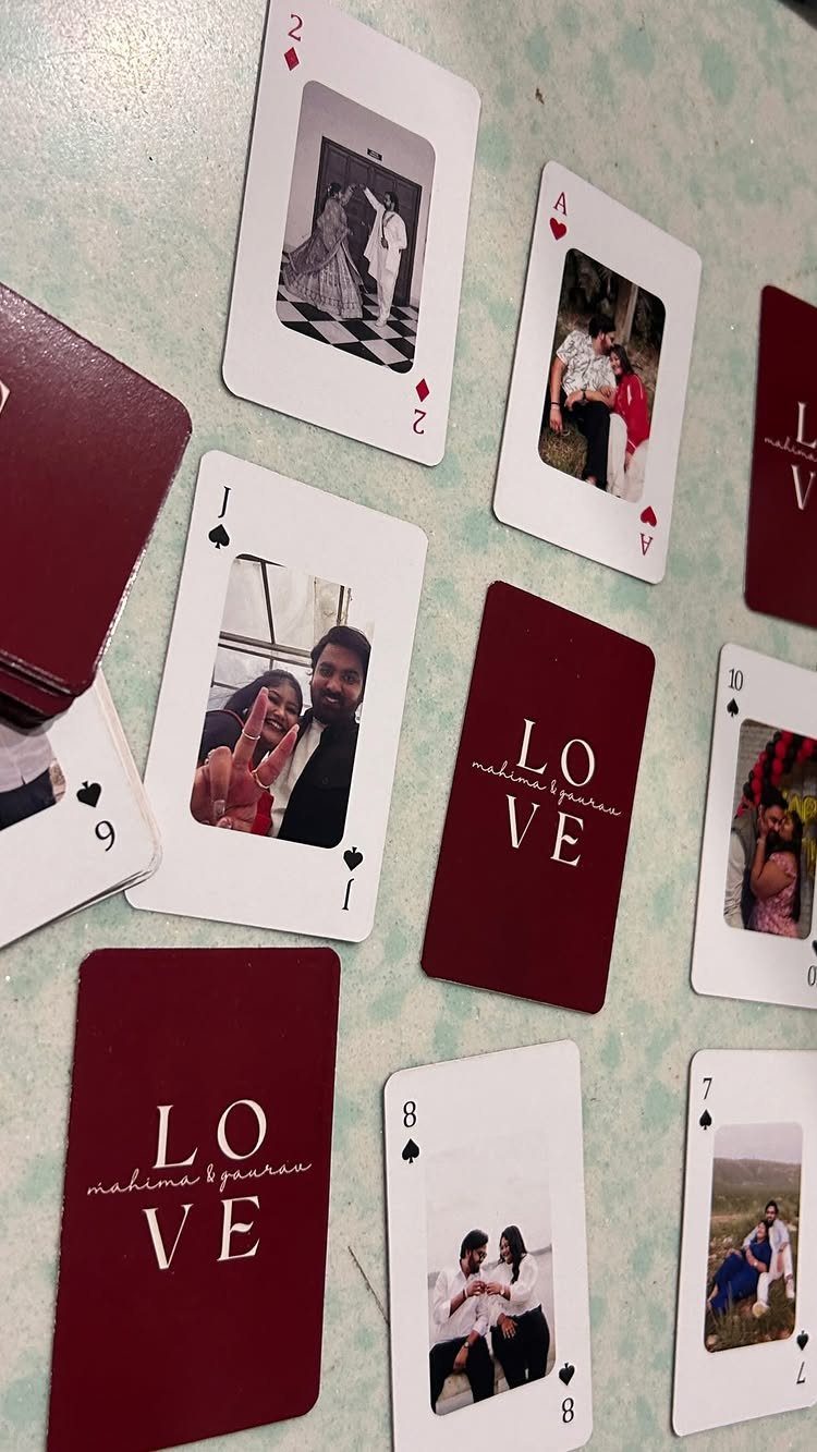 Customized playing cards featuring personal photos of a couple and romantic text.