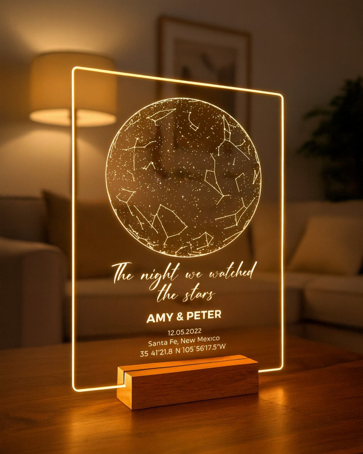 Illuminated acrylic star map plaque with names and date on wooden base