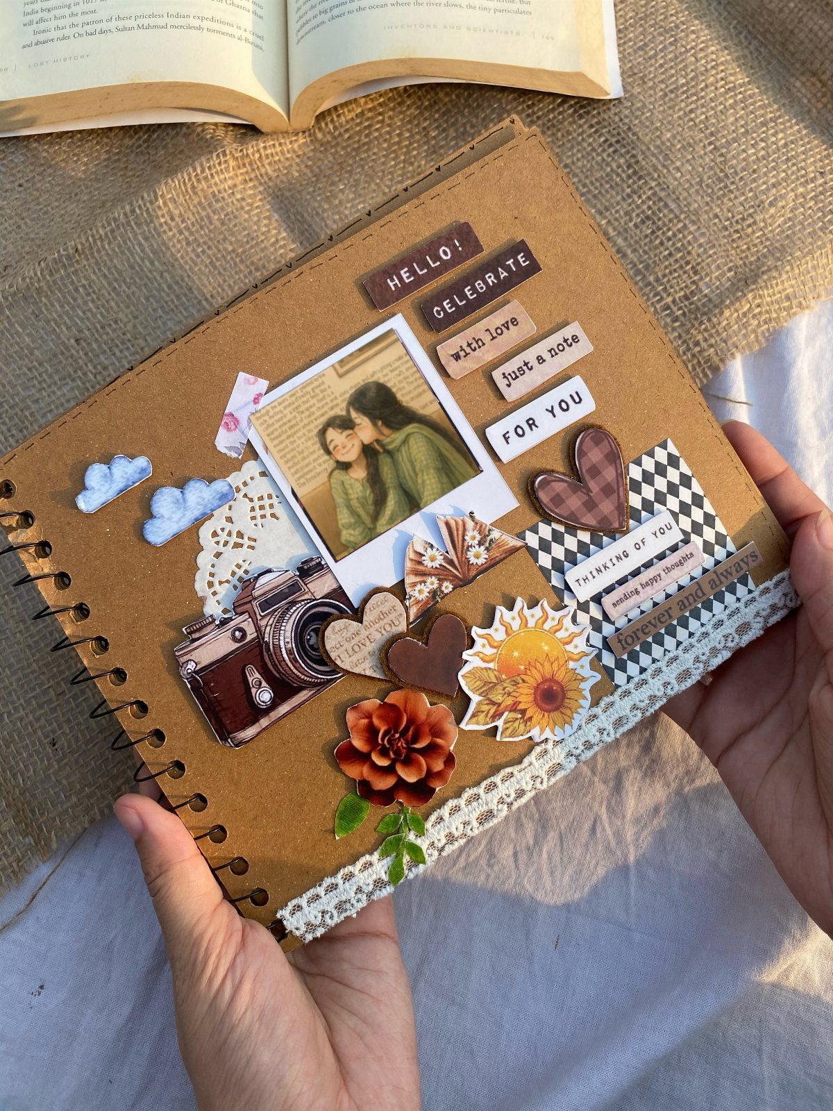 Memory scrapbook page with a couple's photo, vintage camera, and floral decorations.