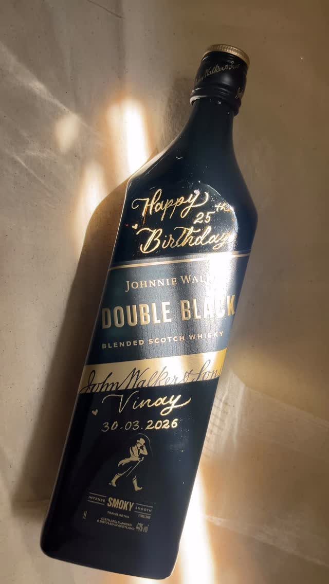Customized Johnnie Walker Double Black whisky bottle with gold birthday calligraphy for Vinay.