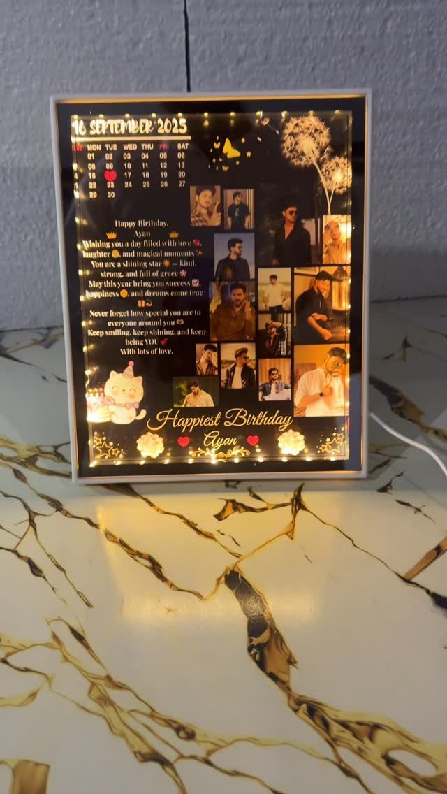 Illuminated birthday gift frame with photos, a calendar, and a personalized message.