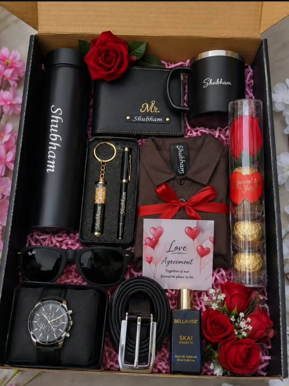 Personalized men's gift hamper with watch, wallet, bottle, and red roses in box