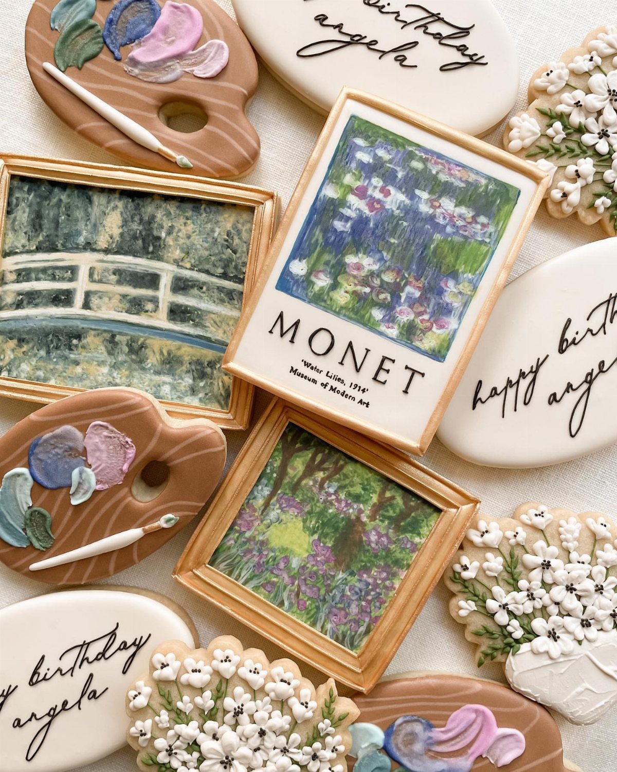 Decorated birthday cookies shaped like art palettes and framed Monet paintings for Angela.