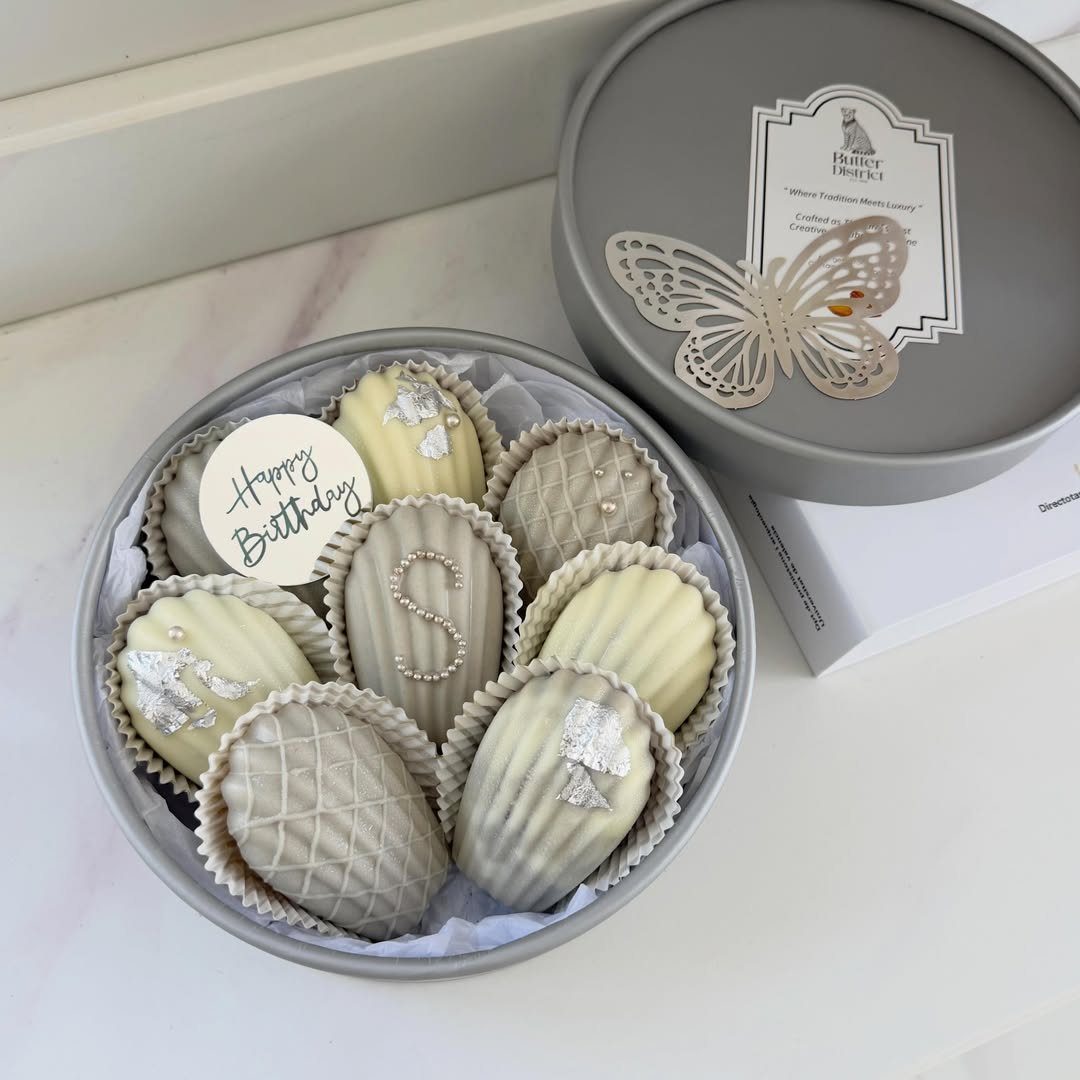 Chocolate covered strawberries in a grey tin with a Happy Birthday tag.