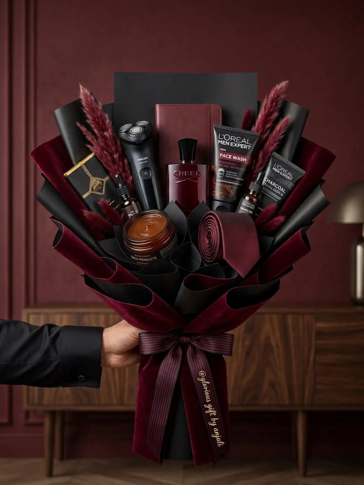 Men's grooming kit arranged as a bouquet with skincare, shaver, and a tie.