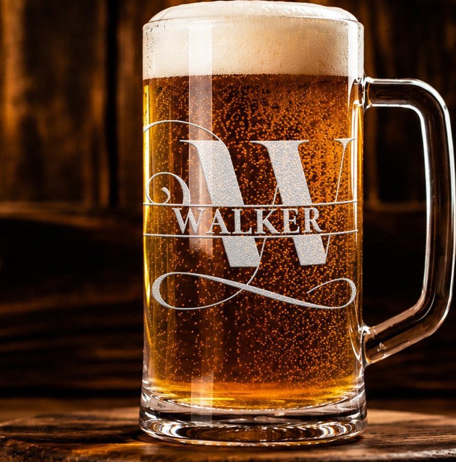 Glass beer stein with engraved name Walker and letter W filled with beer.