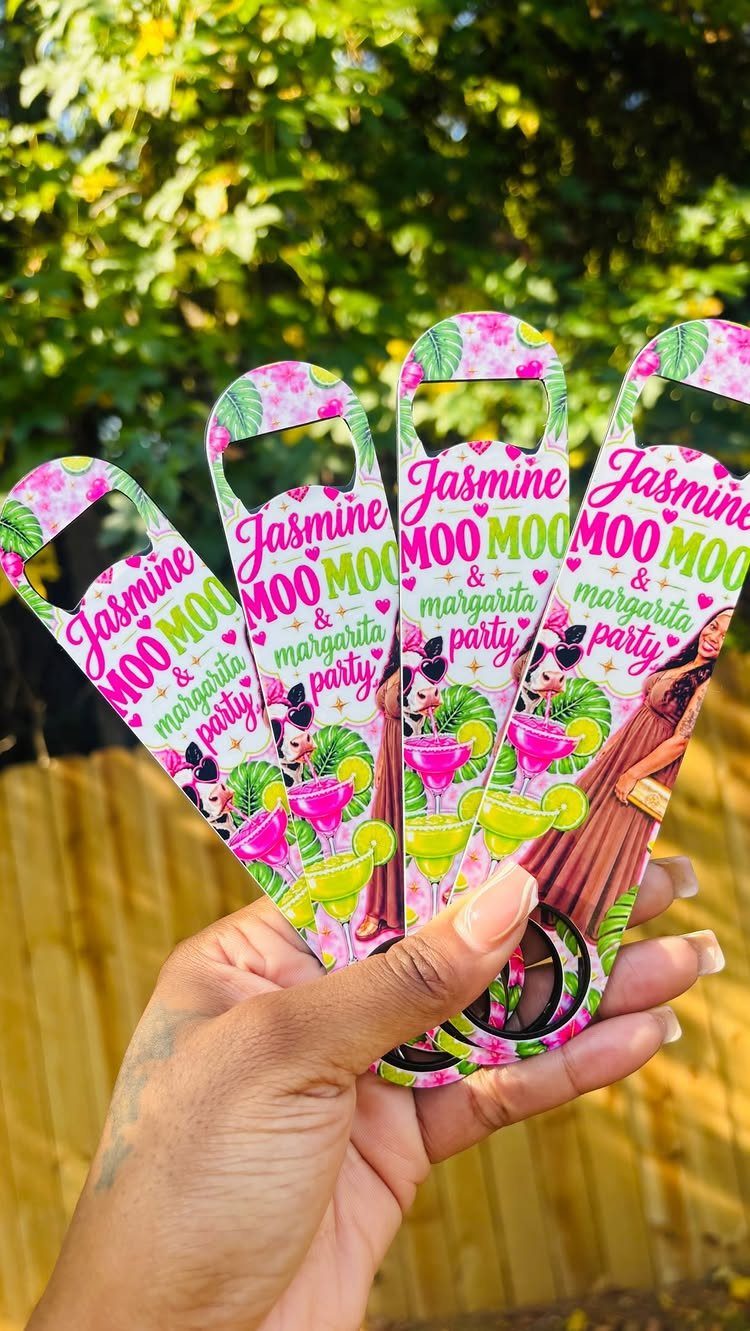 Four personalized metal bottle openers with colorful party graphics held in a hand.