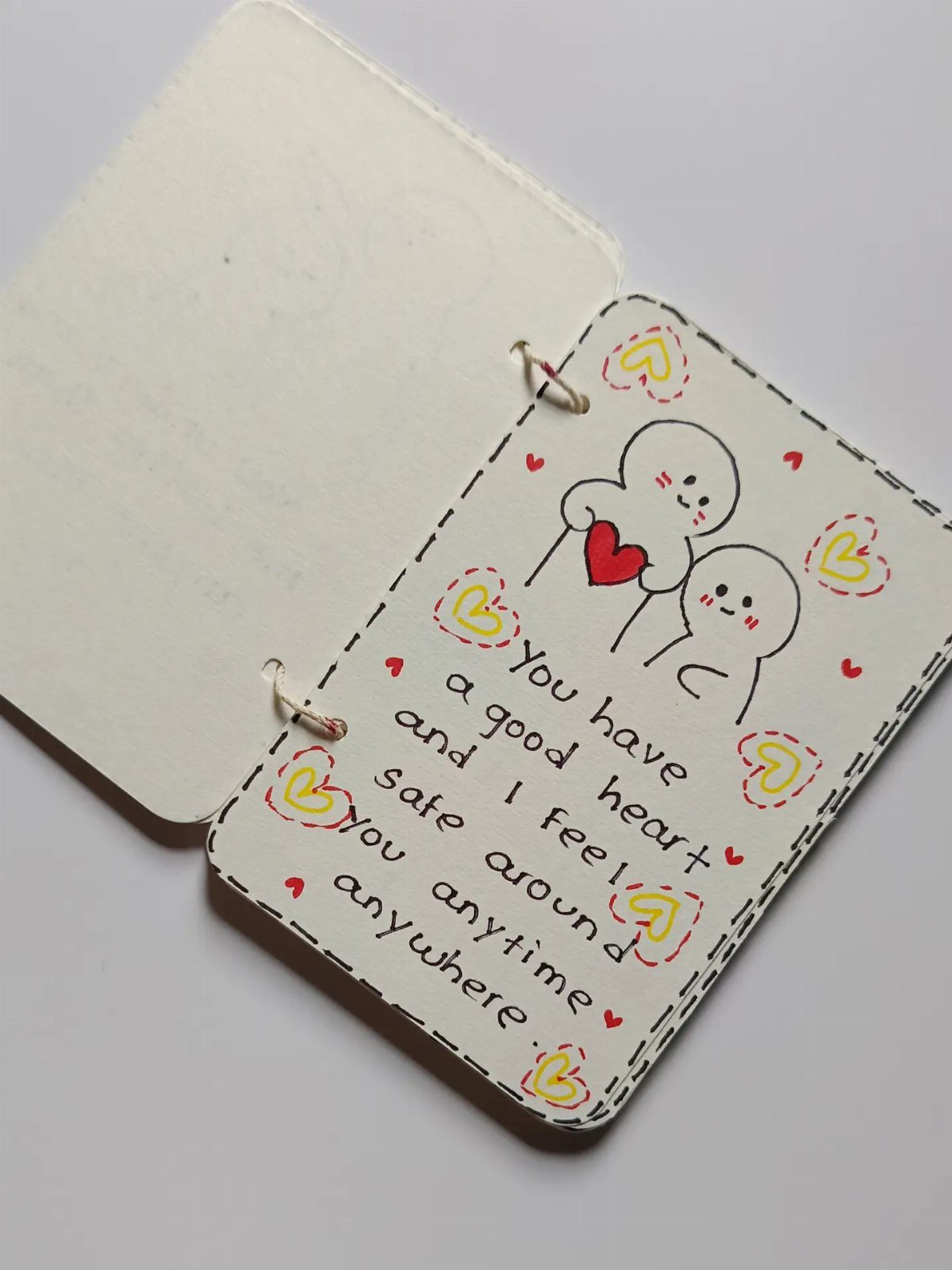 Handmade card with cute characters and a heartfelt handwritten message for a friend.