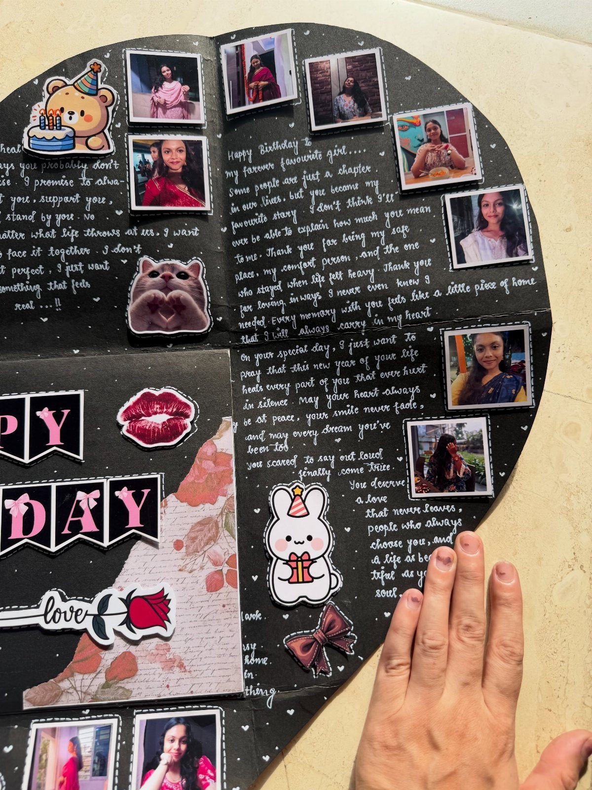 Handmade black scrapbook with photos, handwritten birthday notes, and cute stickers.