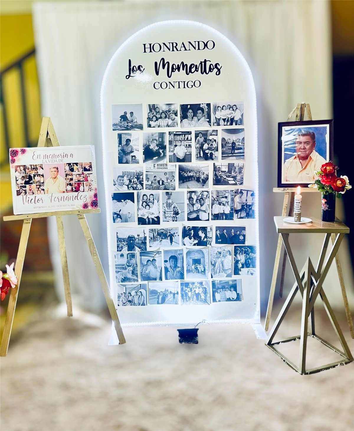 Memorial photo display with an arched board of memories and framed portraits.