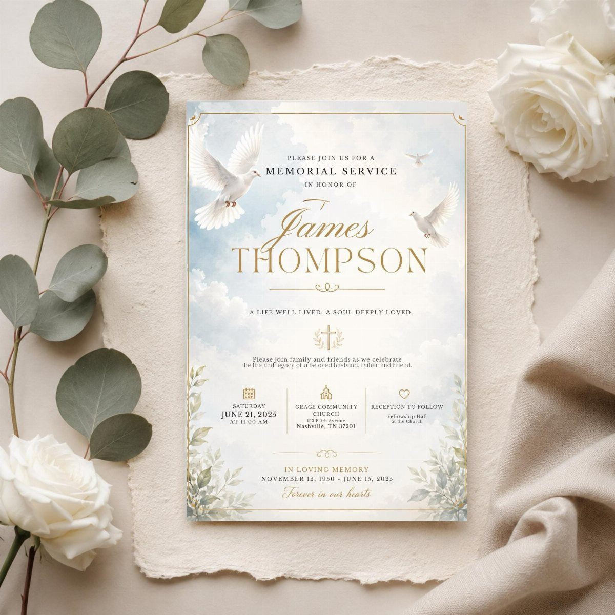 Memorial service invitation card with doves, surrounded by white roses and eucalyptus leaves.