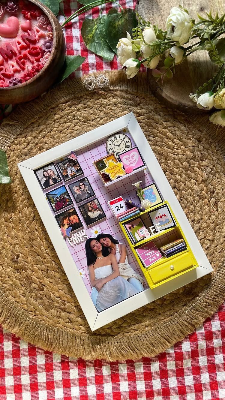 3D shadow box frame featuring miniature room decor and photos of two friends.