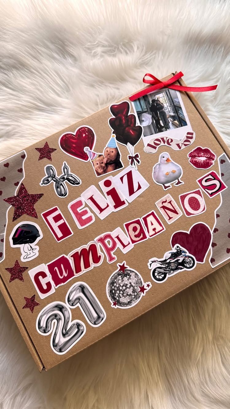 Decorated brown gift box for a 21st birthday with Spanish text and stickers.