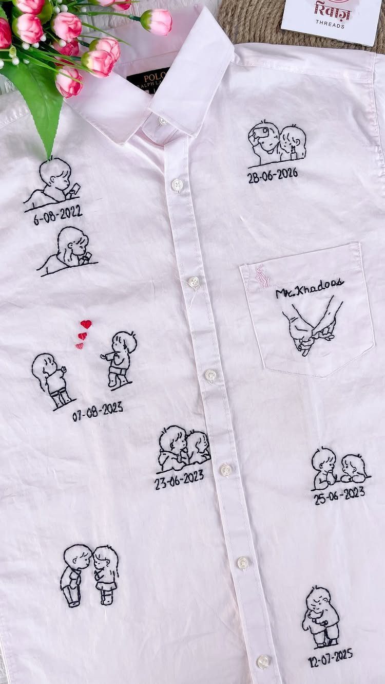 White button-down shirt with embroidered line-art illustrations of a couple and dates.