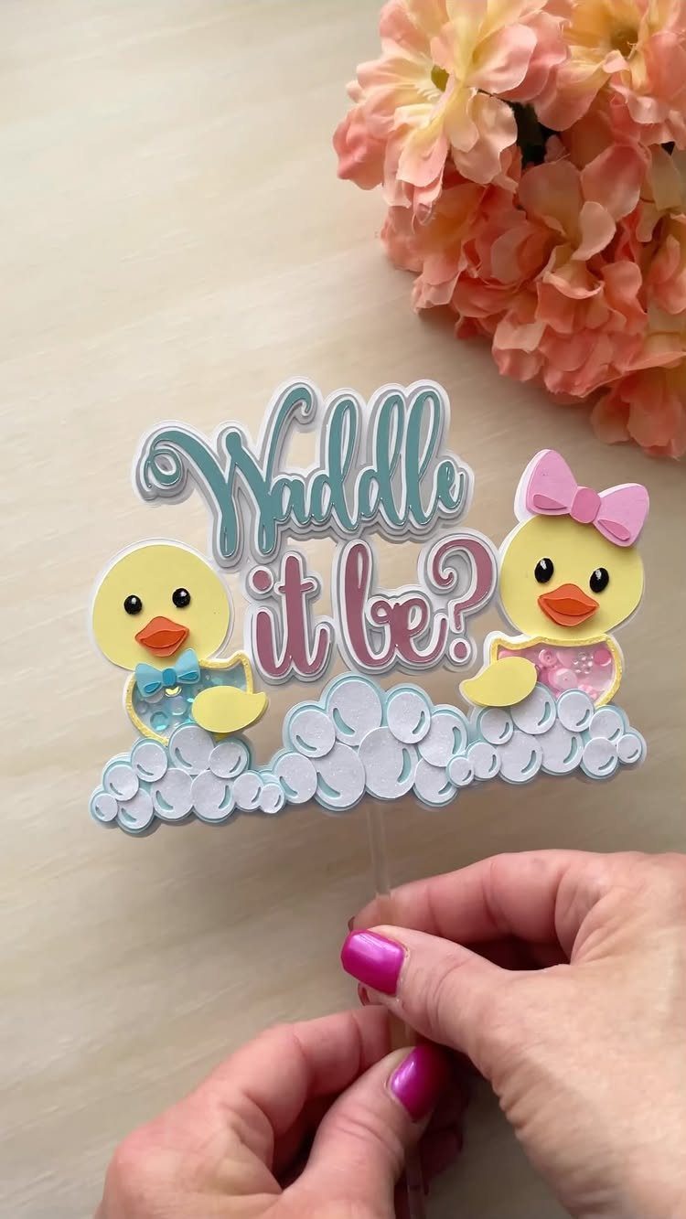 Gender reveal cake topper with yellow ducklings and text Waddle it be?