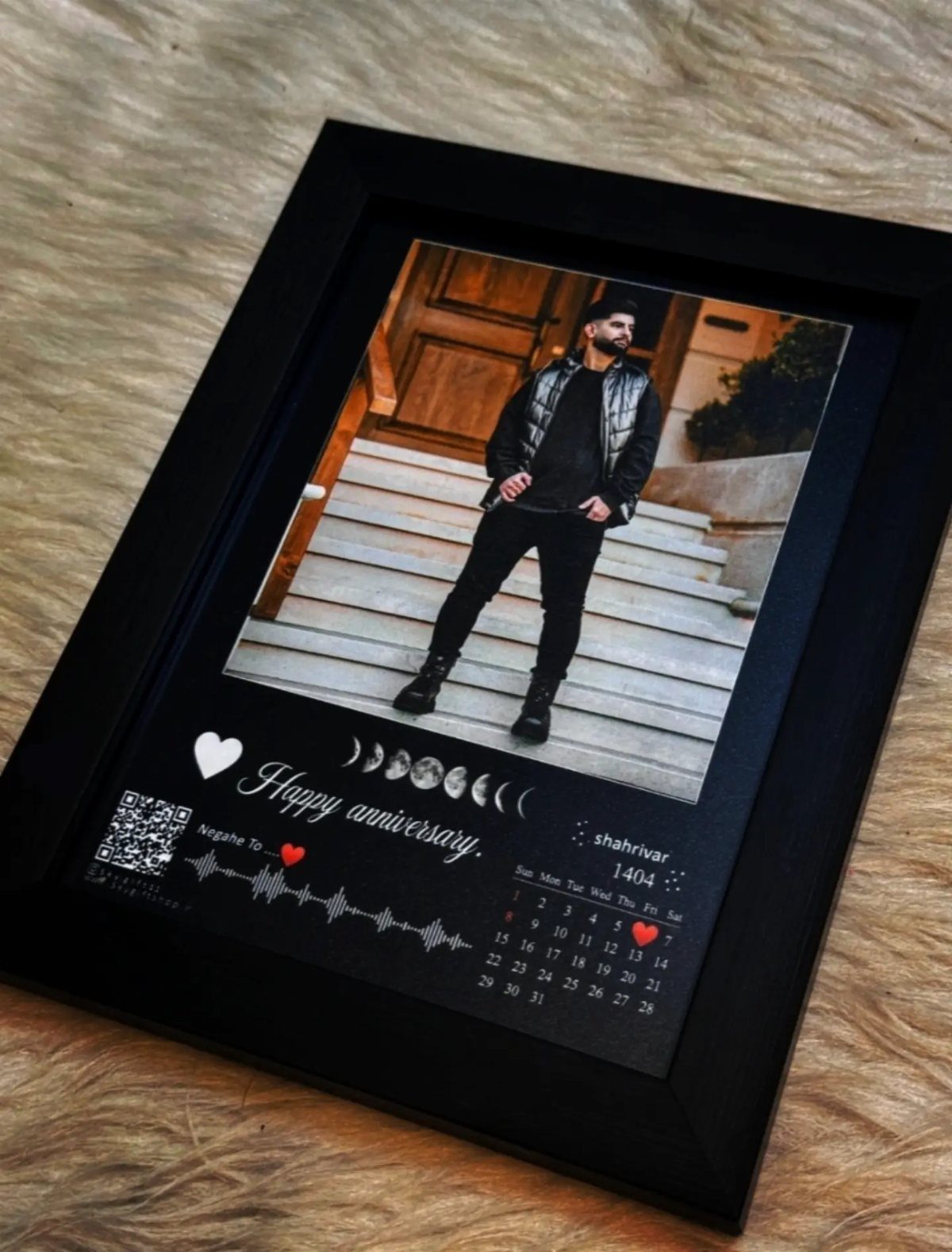 Framed anniversary print with a man's photo, sound-wave art, and a calendar.