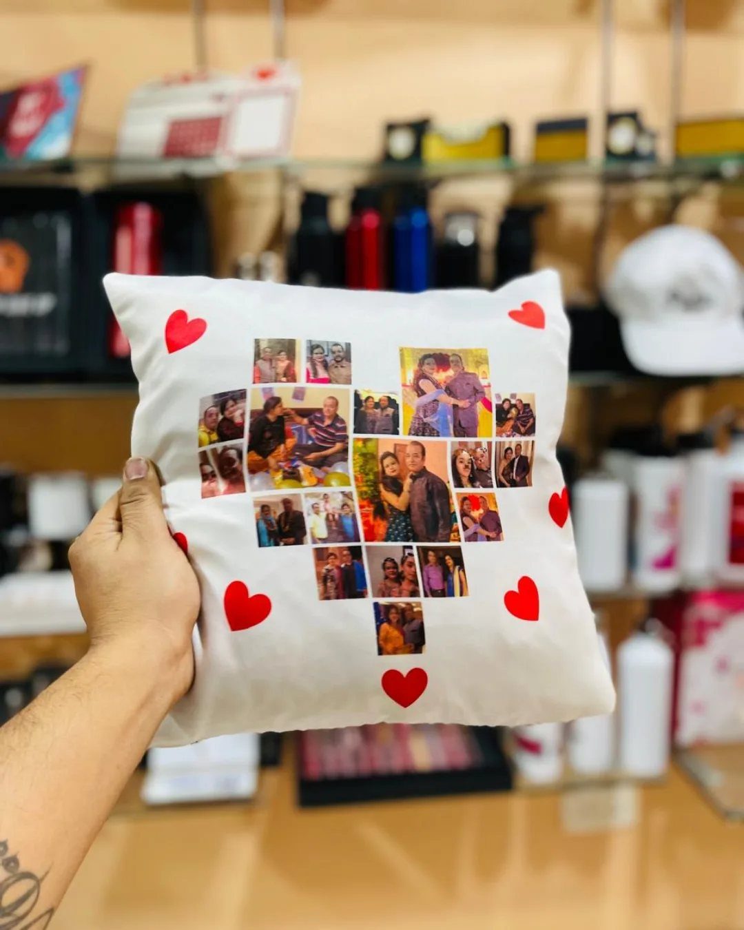 White pillowcase with a heart-shaped photo collage and red hearts held by hand.