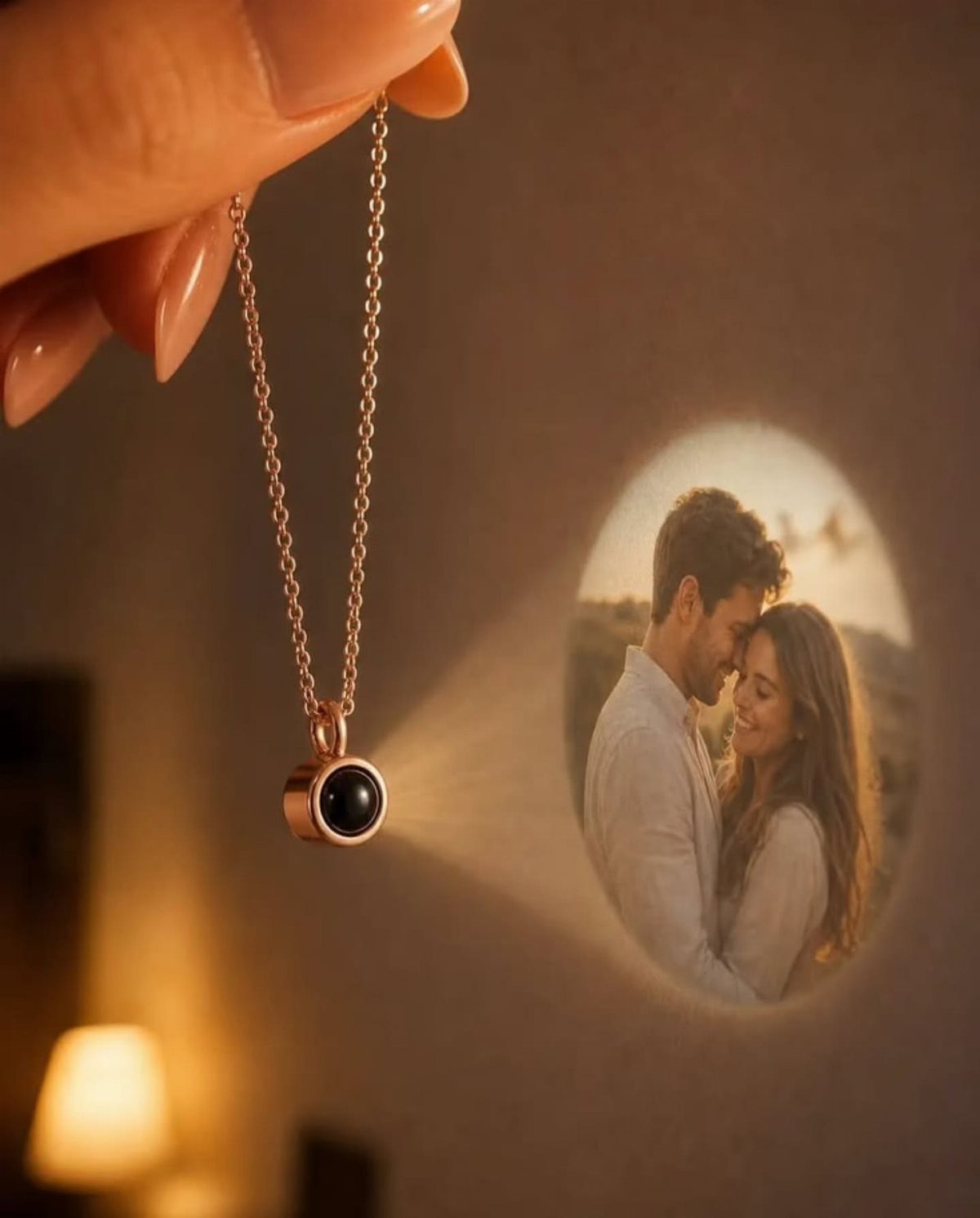 Rose gold projection necklace displaying a photo of a couple on a wall