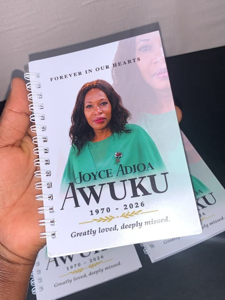 Spiral-bound memorial guest book with a woman's portrait and commemorative text on cover