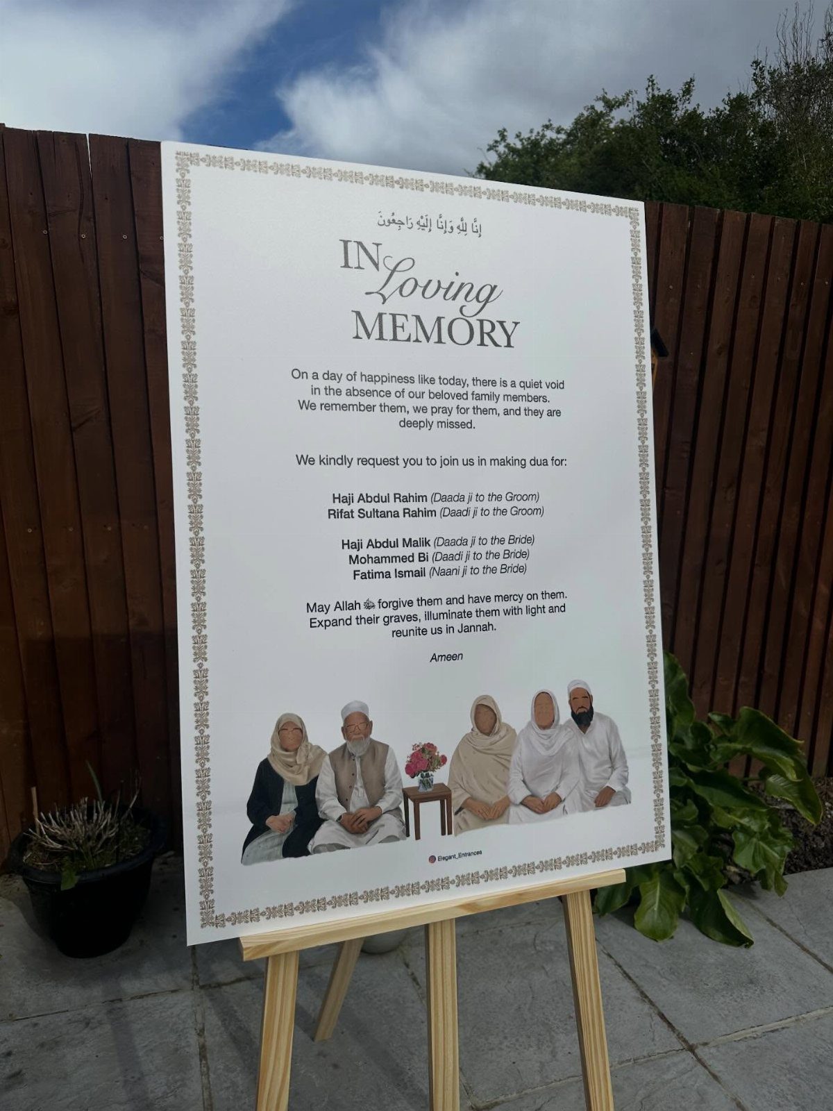 Memorial poster on a wooden easel with text and an illustration of people.