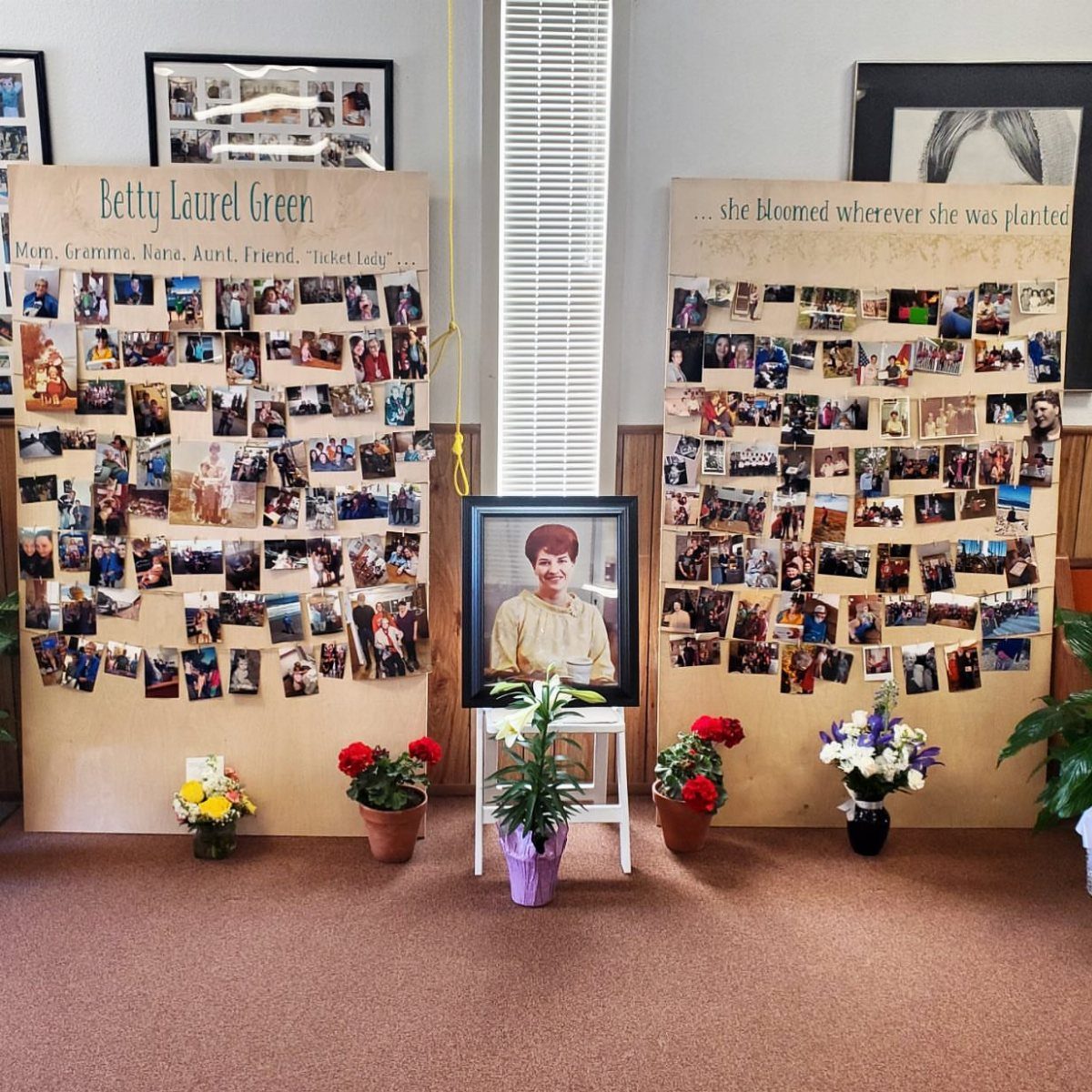 Two tan memory boards with photos and a framed portrait for a celebration of life