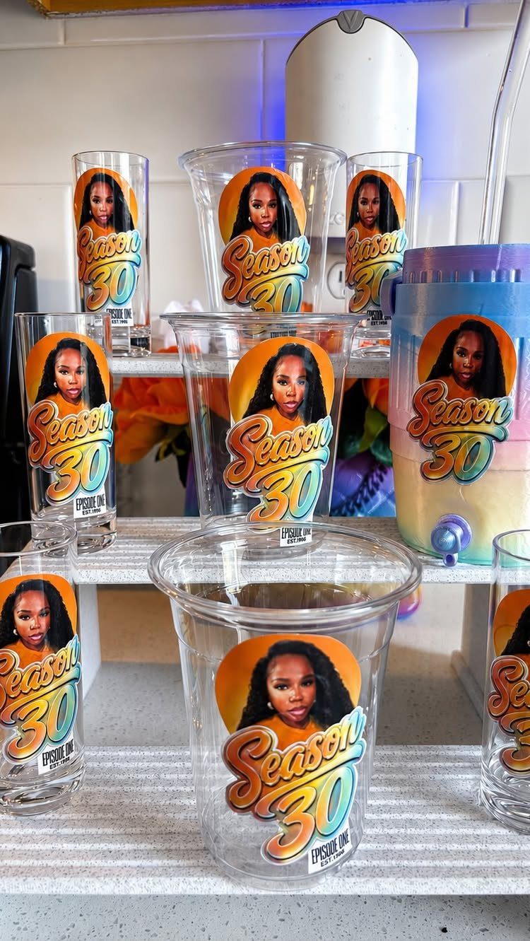 Customized clear party cups with a woman's photo and Season 30 text.