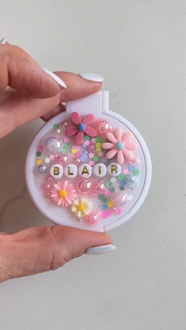 Personalized compact mirror with pink flowers and the name Blair in letter beads.