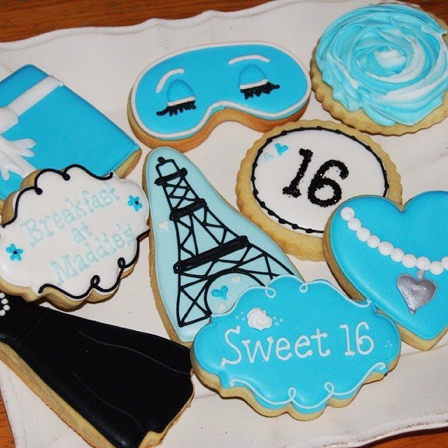 Themed sugar cookies for a Sweet 16 featuring the Eiffel Tower and Tiffany blue.