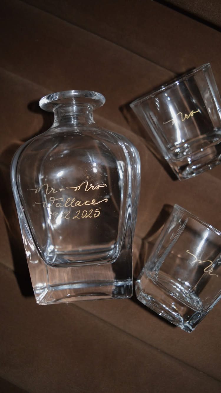 Personalized glass decanter and two glasses with gold cursive wedding anniversary engraving