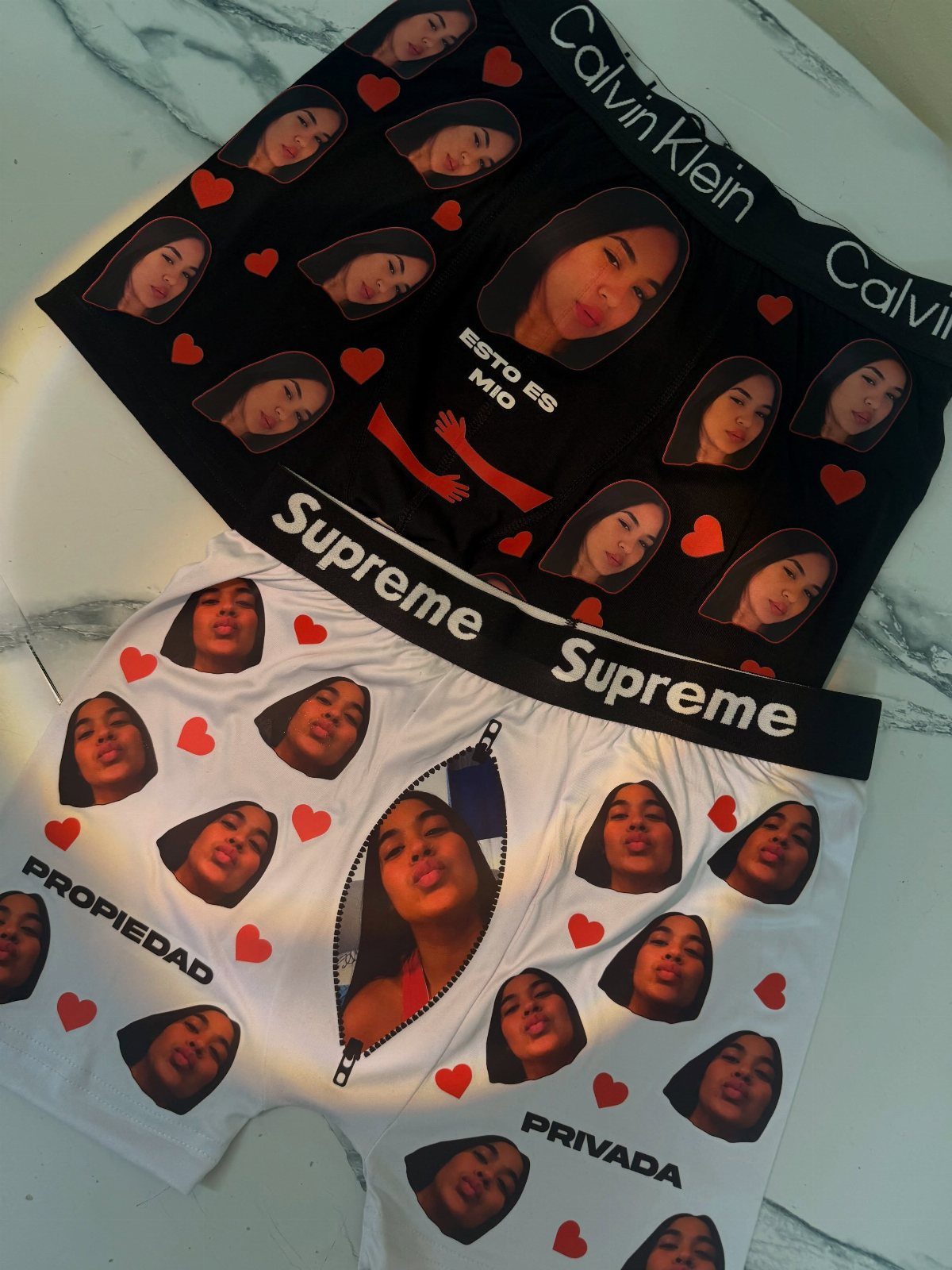Custom boxer briefs in black and white featuring a woman's face and hearts.