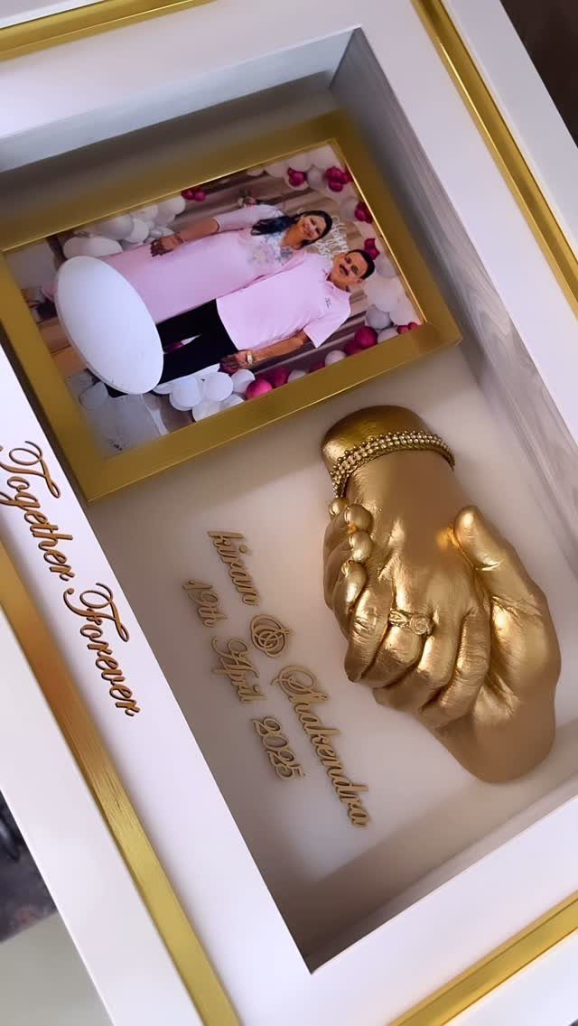 Shadow box with gold hand sculpture, couple's photo, and Together Forever text.